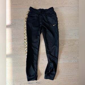 Nike Black Joggers with Gold Detailing